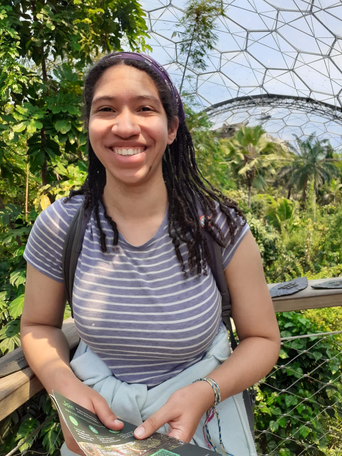 A photo of Maya in a biome at the Eden Project with plants in the background